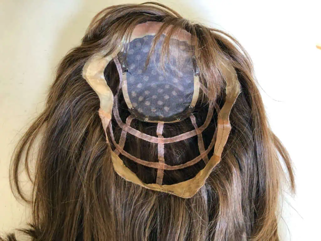 Inside of a custom hairpiece from Charle a Hair Studio, showing the base built to fit one client